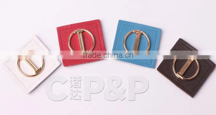 Delicate metal label branded leather patch in garment