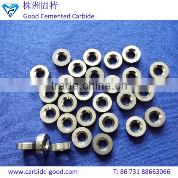 Discharge valve seat made from tungsten carbide