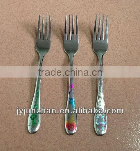 Stainless dinner fork with mirror polish and colorful laser logo