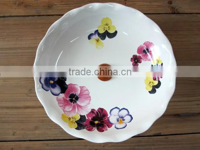 Elegant ceramic cake plate with wood base
