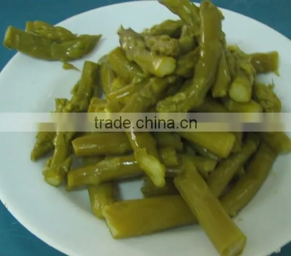 Green asparagus spears in glass jar