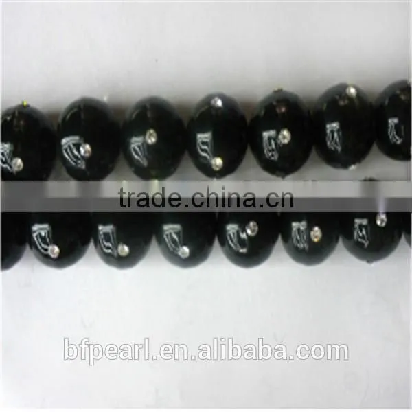 Best Price of 14mm Black Shell Pearls Beads with 4 Crystal Beads for Sale