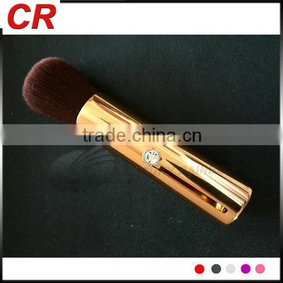 Golden cosmetic brush portble use with beautiful crystals
