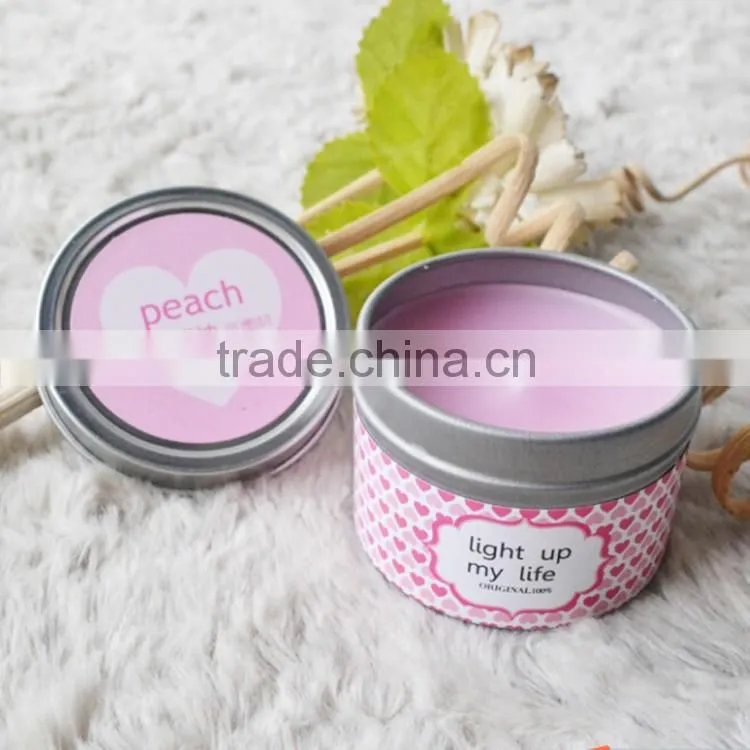 Multi-colored scented tin candles with metal lid