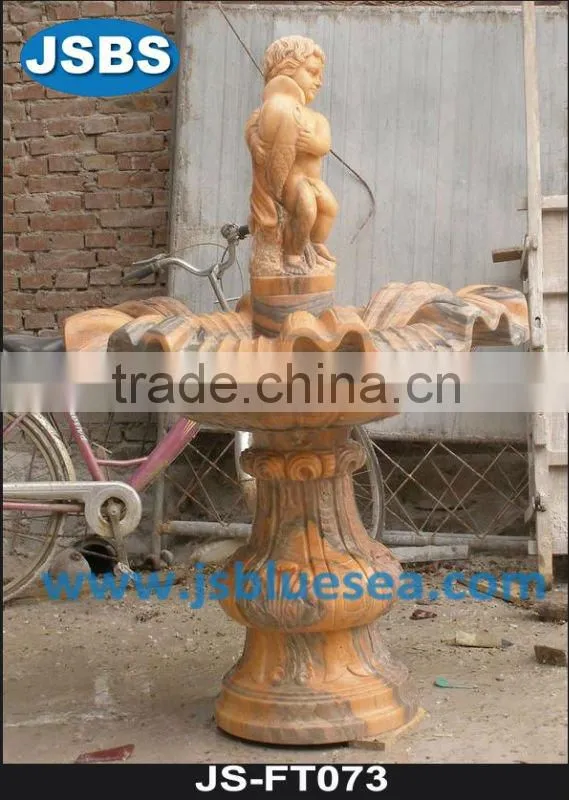 White marble wall fountain with angel