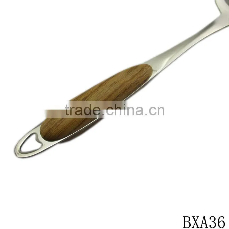 Professional stainless steel cooking spatula with wood handle