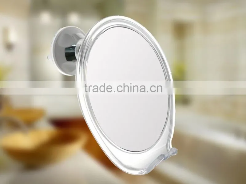 Fog free bathroom shaving mirror with a razor holder
