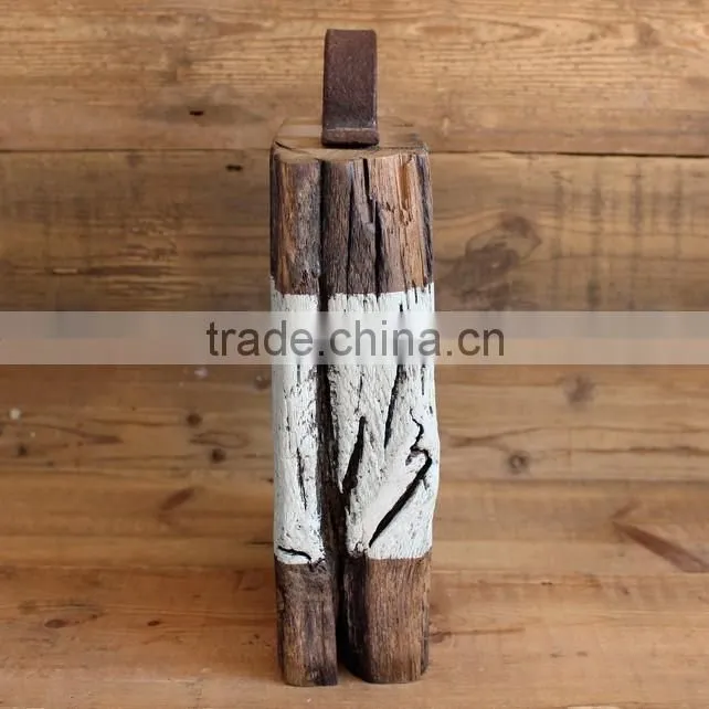 older aged wooden door stop