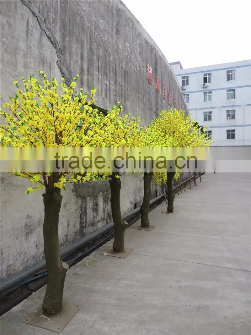 Yellow silk cherry blossom tree with artificial flower