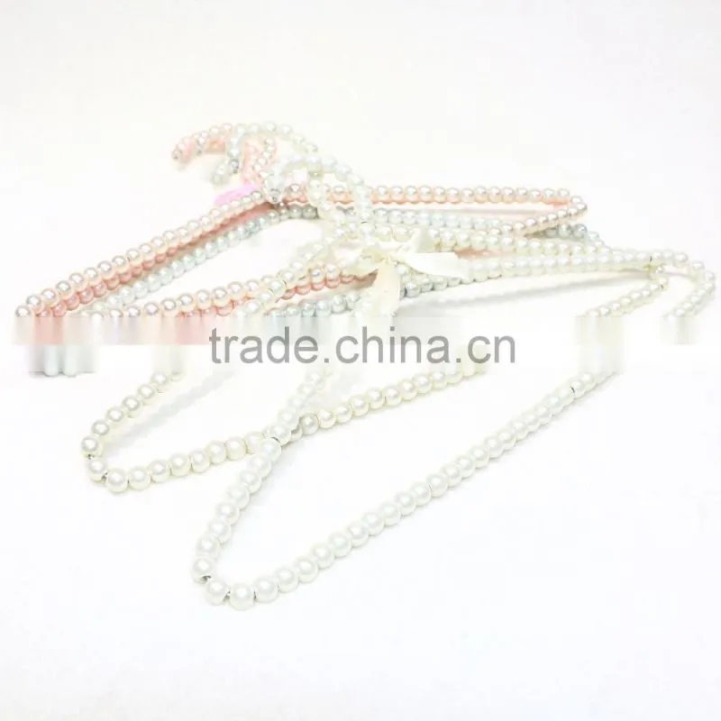 New design cheap brass pearl clothes hanger