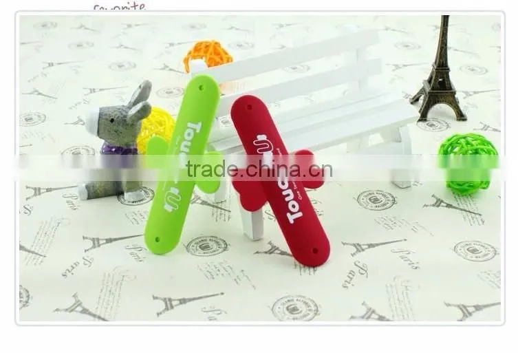 Universal silicone phone holder/touch-U phone stand
