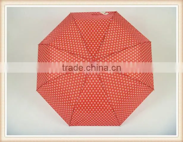 Red fold umbrella with white flower handle color match the fabric
