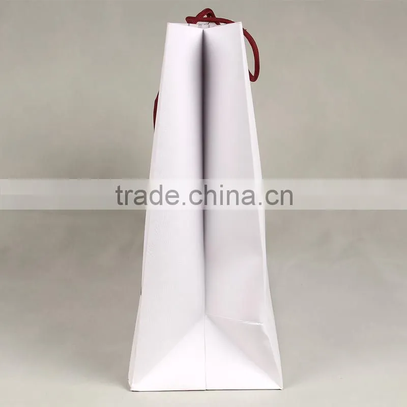 2015 New fine custome logo printed shopping bag ,gift bag,paper bag with handle for snowsuit/winter clothes