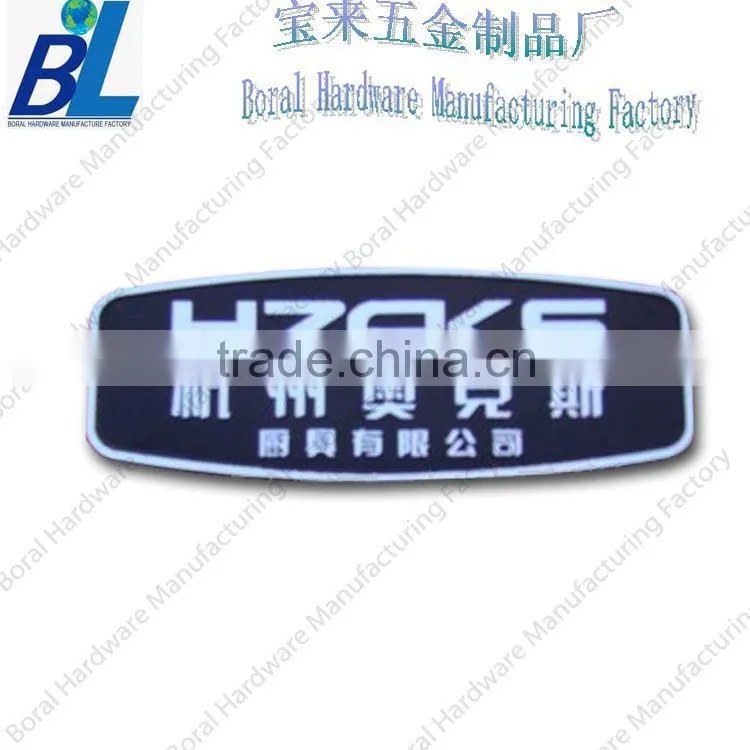 Oval aluminum stamped hanging nameplate