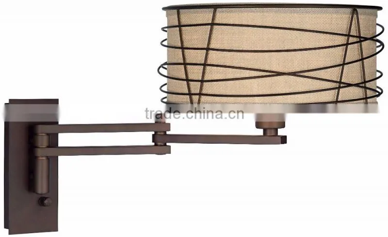 1031-1 wire cage detail surrounds a burlap shade a rich Bronze Metal Swing Arm Wall Lamp