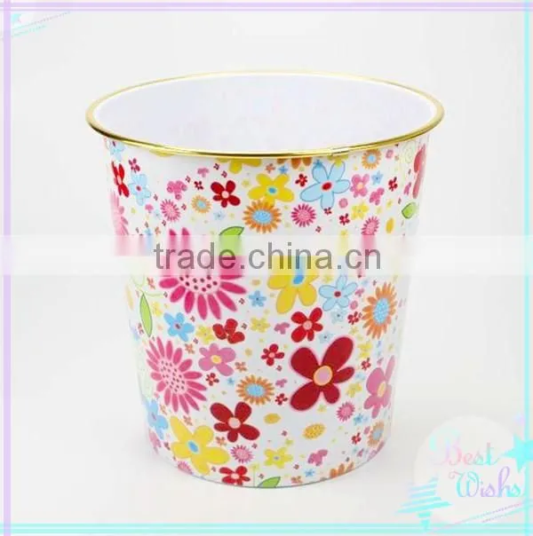 Plastic waste bin with golden edge