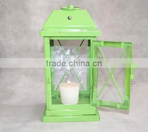 green metal lantern with clear glass wall