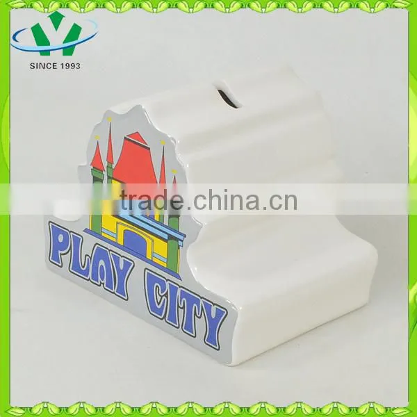 Ceramic piggy bank counting money castle house