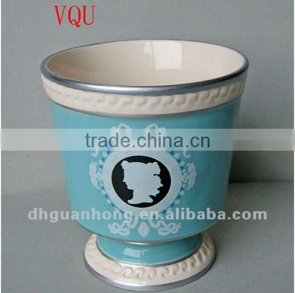 Stock ceramic flower pot in pink color round shape