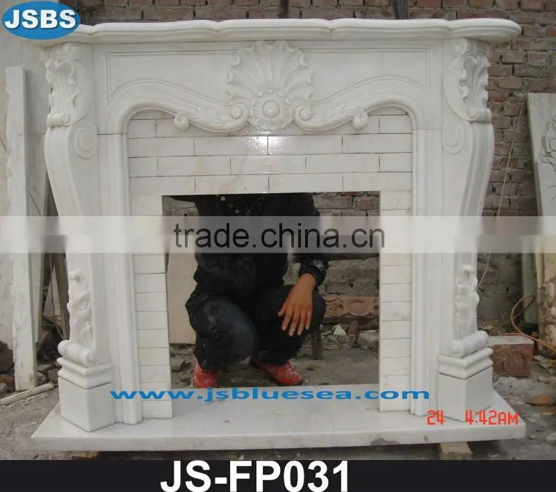 Cream marble fireplace with lady statue