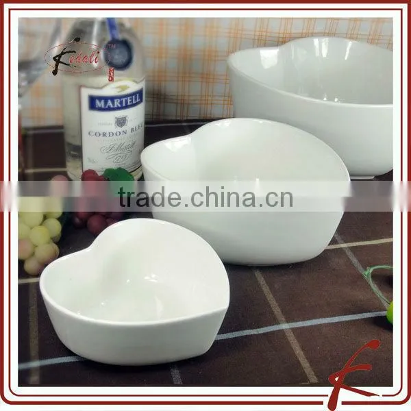 white ceramic heart shaped bowl