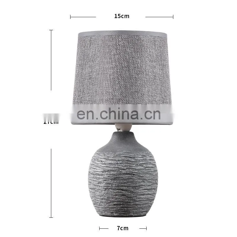 antique ceramic meterial beside table lamp