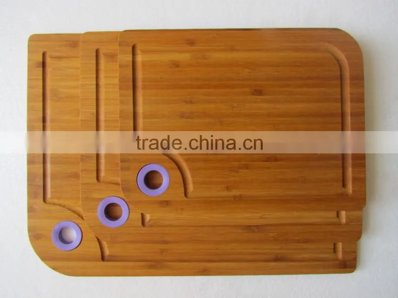 Three size bamboo cutting board with silicon handle