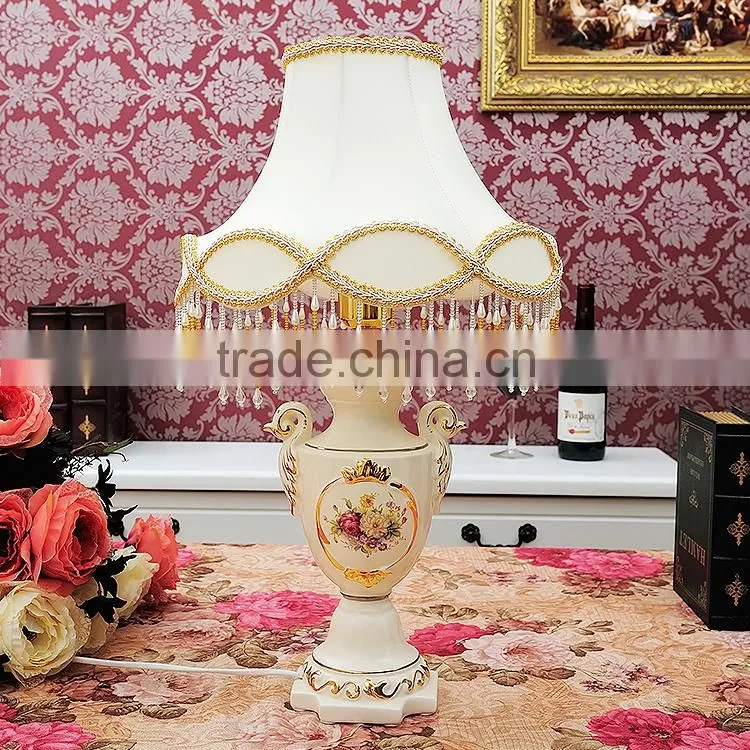 Gold outline home goods ceramic vase table lamp in bedroom