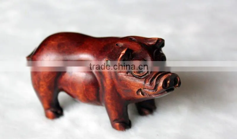 Artistic sandalwood carving pig