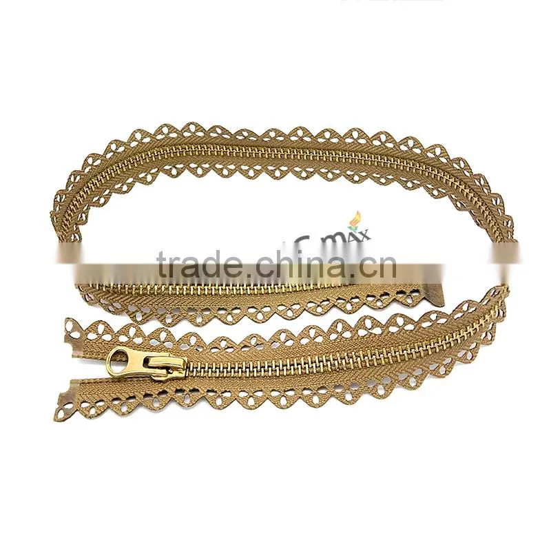 One close Euro style shiny gold metal zip for bag
