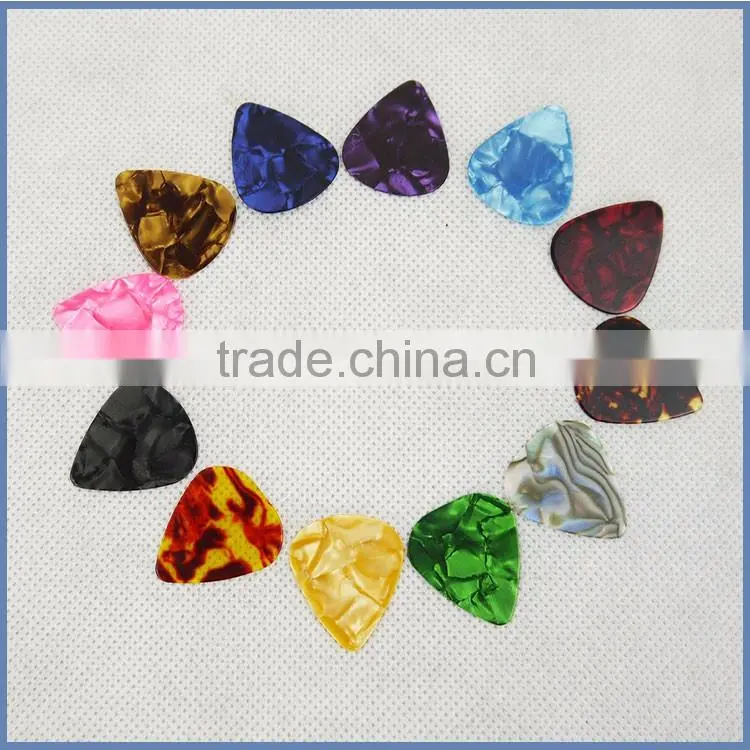 Different size guitar pick sheet material for acoustic guitar