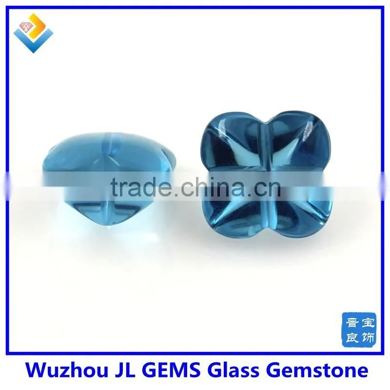 Synthetic glass gem stone with four leaf clover stone