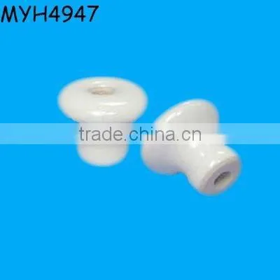 Plain white ceramic door knob with gold trim