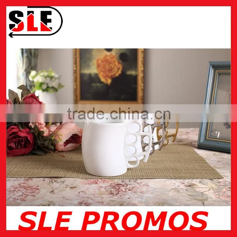 Hot Sale New Product Design Wholesale Ceramic Fist Cup,Brass Knuckle Duster Handle Coffee Milk Mug Cup Cool Gift Promotional AD