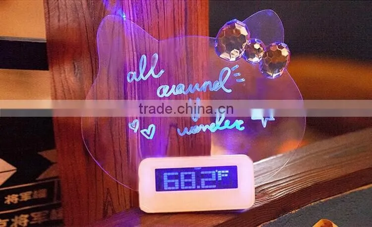 Multi function digital alarm clock with board for leaving a message