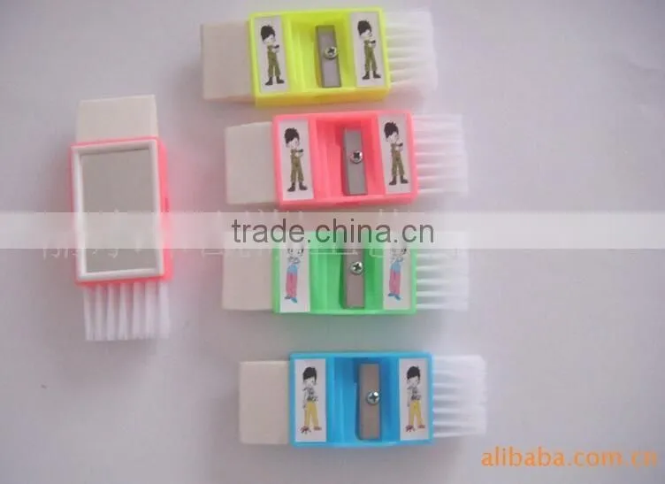 Plastic sharpener with eraser and brush