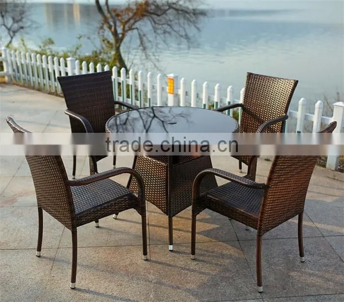 The outdoor bistro table and stackable rattan chairs