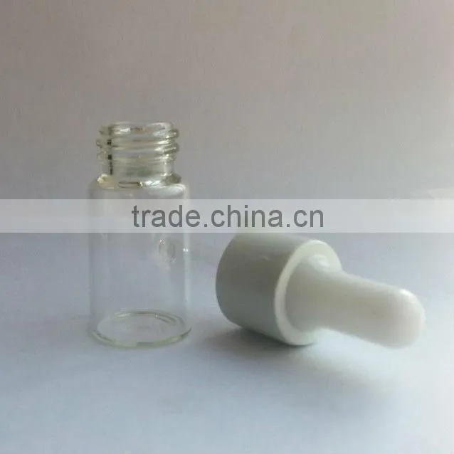 glass essential oil bottle with plastic cap and rubber dropper
