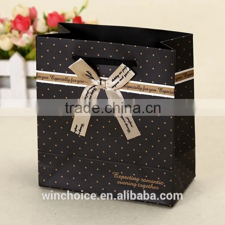 Ivory board /art paper bag ,shopping bags,promotion bag ,cotton rope handle , customized printing is welcome,with bow-knot Decor