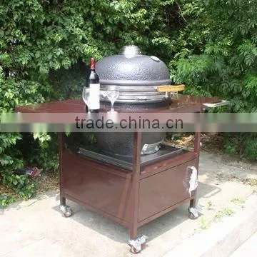 Holland Clay charcoal egg bbq grill with brown iron table