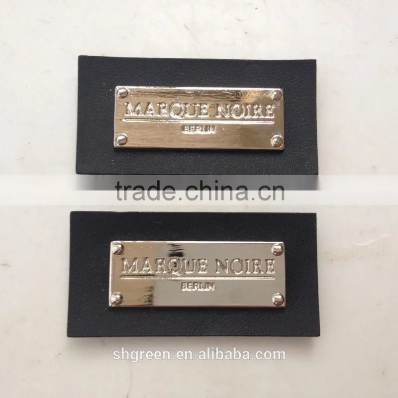 Promotional white real leather label with engraved logo metal plate