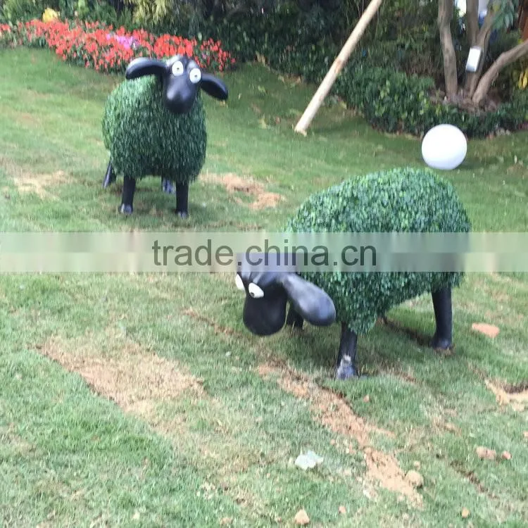 Fiberglass goat statue with artificial grass