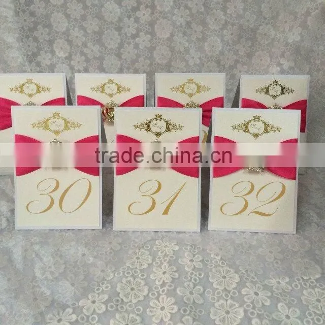 fold tablenumber with matching ribbon of invitationswedding invitations table