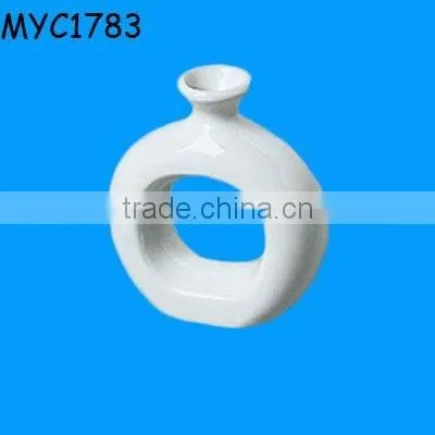 White ceramic napkin ring vase