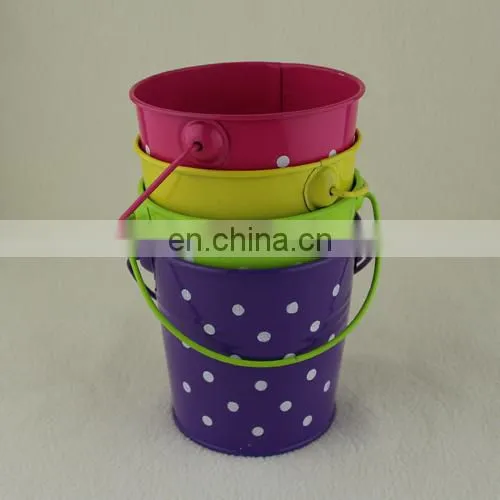 small colorful metal pail with handle