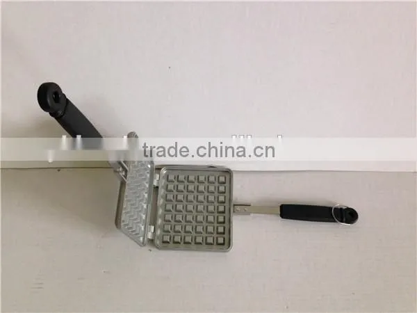 aluminum die cast non stick waffle iron maker on camp fire