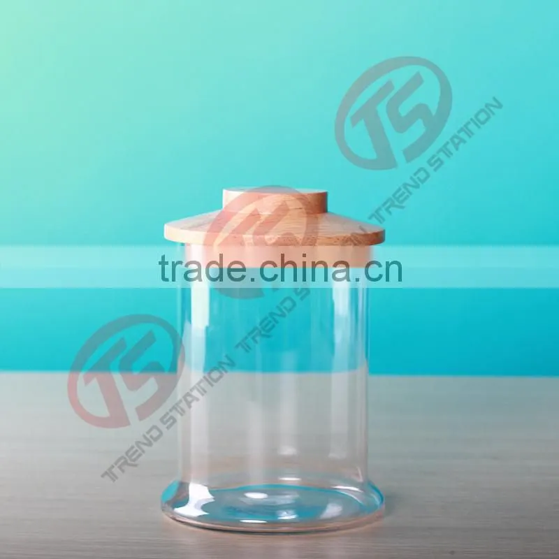 Large handmade glass storage jar with wooden lid