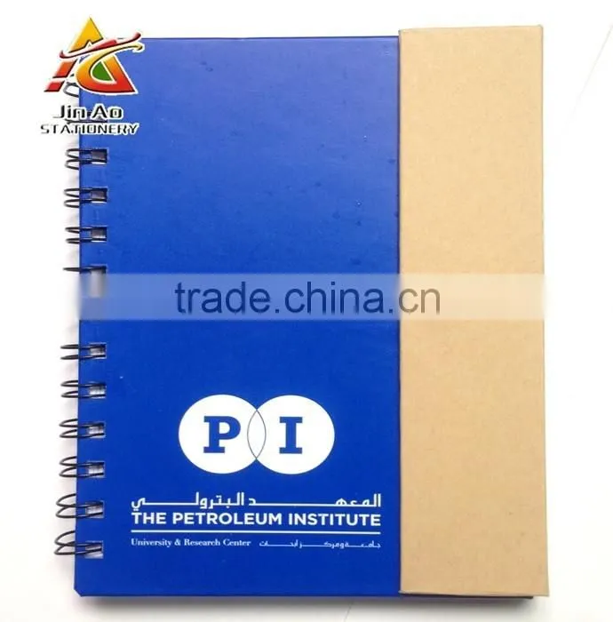 notebook with sticky notes and pen