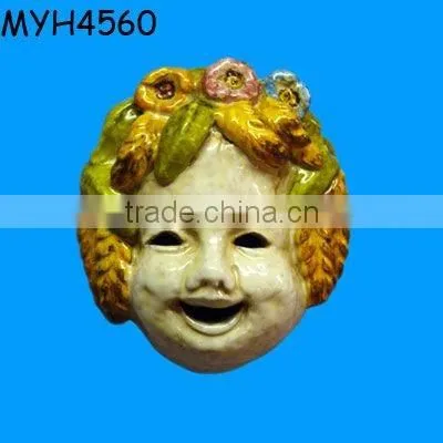 A sweet, handmade and hand painted Italian ceramic mask adorned with grapes