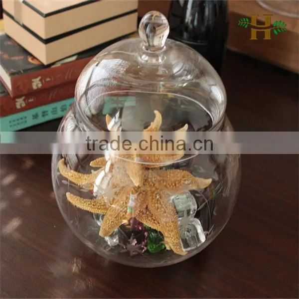 Handmade footed large glass jar with food arrangement